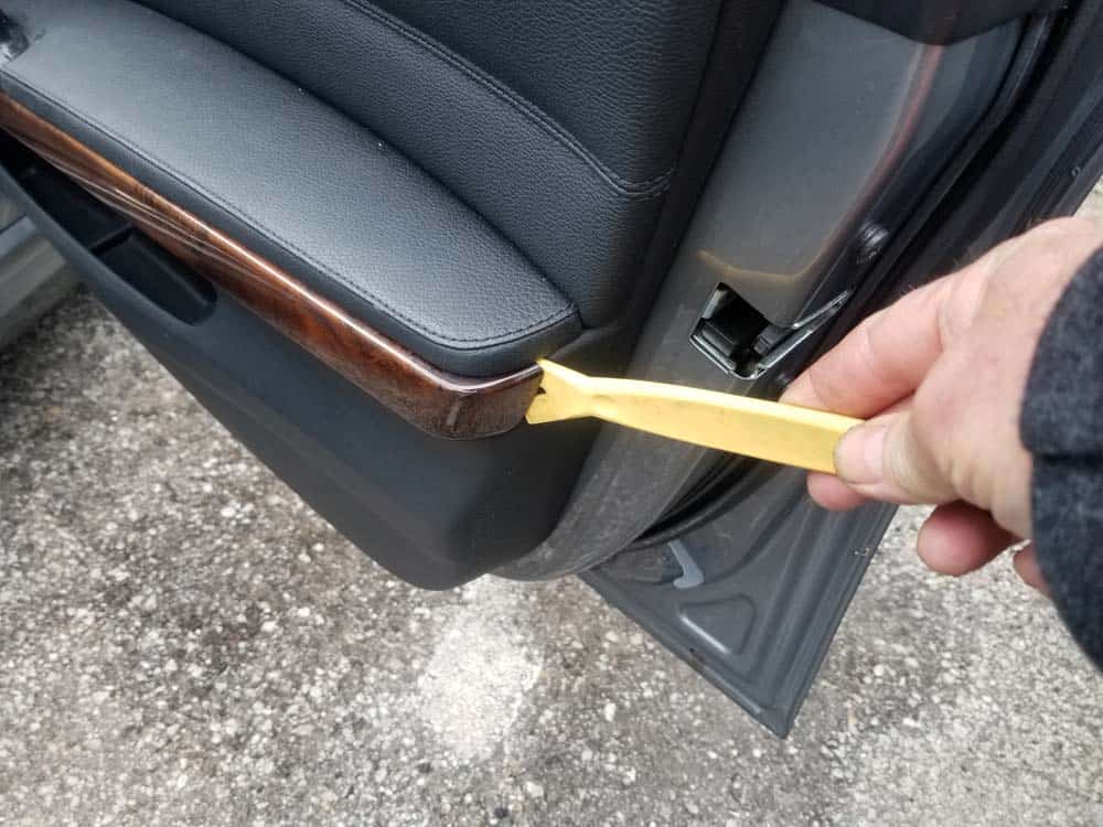 bmw e90 door handle replacement - Pry the armrest trim loose 