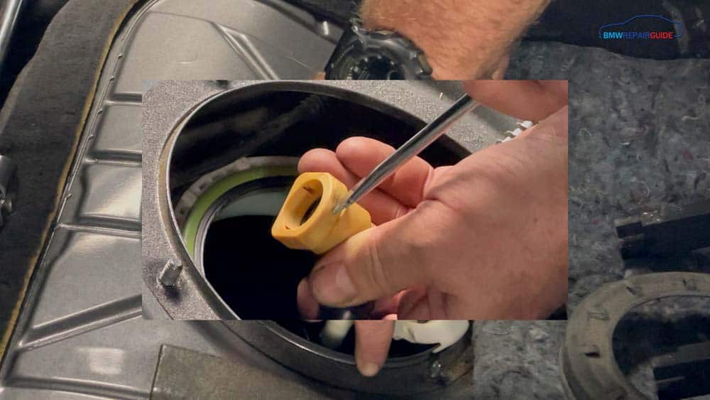 To remove the fuel line, depress the release with a screwdriver
