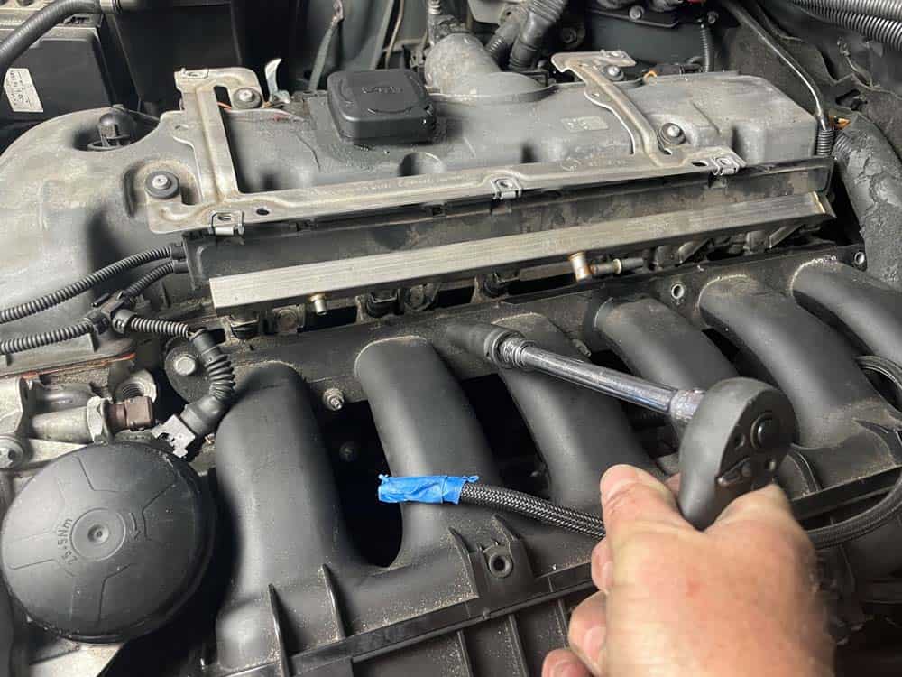 Remove the last four intake manifold fasteners